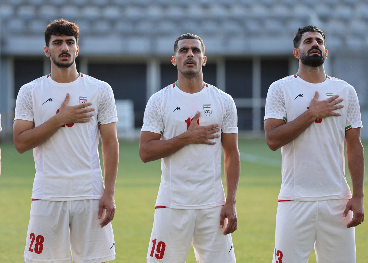 Soccer Football - International Friendly - Iran v Gambia - Mardan Sports Complex, Antalya, Turkey - May 29, 2026 Iran's Amir Razzaghinia, Ali Nemati and Hossein Kanani line up during the national anthems before the match REUTERS/Umit Bektas