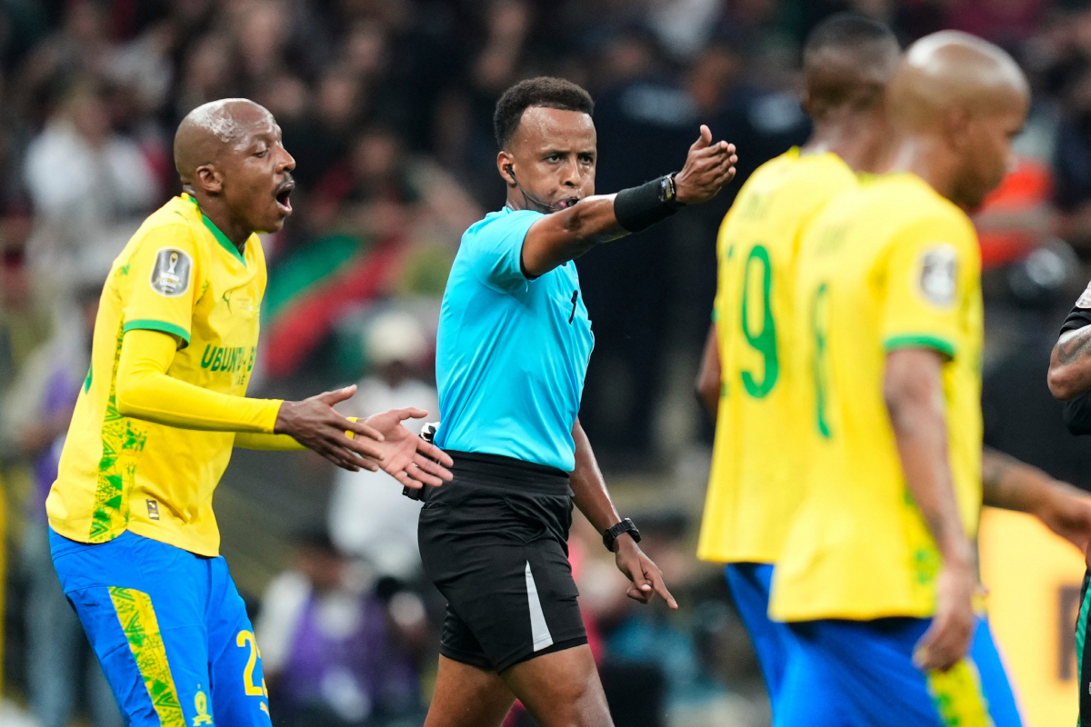 FILE - Referee Omar Artan, center, signals a penalty during the CAF Champions League final soccer match between AS FAR Rabat and Mamelodi Sundowns, in Rabat, Morocco, Sunday, May 24, 2026. (AP Photo/Mosa'ab Elshamy, File) FILE PHOTO