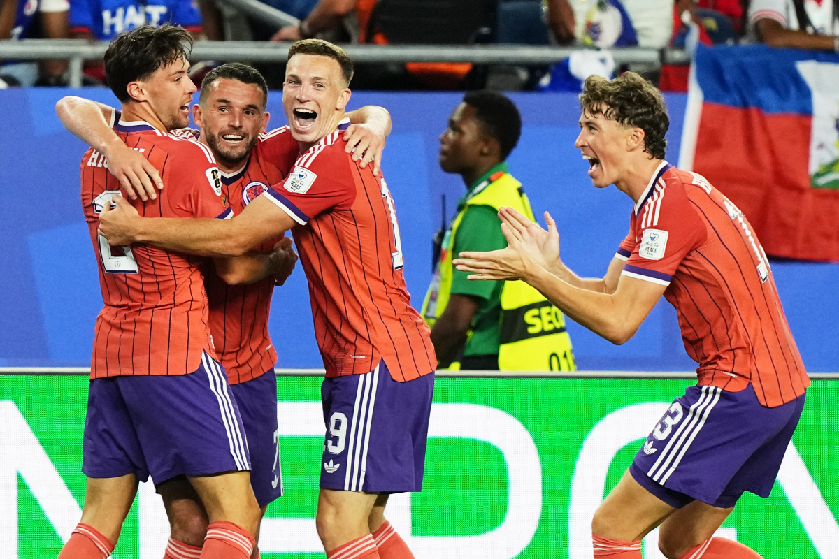 Scotland's John McGinn (7) celebrates with teammate's Aaron Hickey (2), Lewis Ferguson (19) and Jack Hendry (13) after scoring his teams first goal during the World Cup Group C soccer match between Haiti and Scotland in Foxborough, Mass., near Boston, Saturday, June 13, 2026. (AP Photo/Martin Meissner)