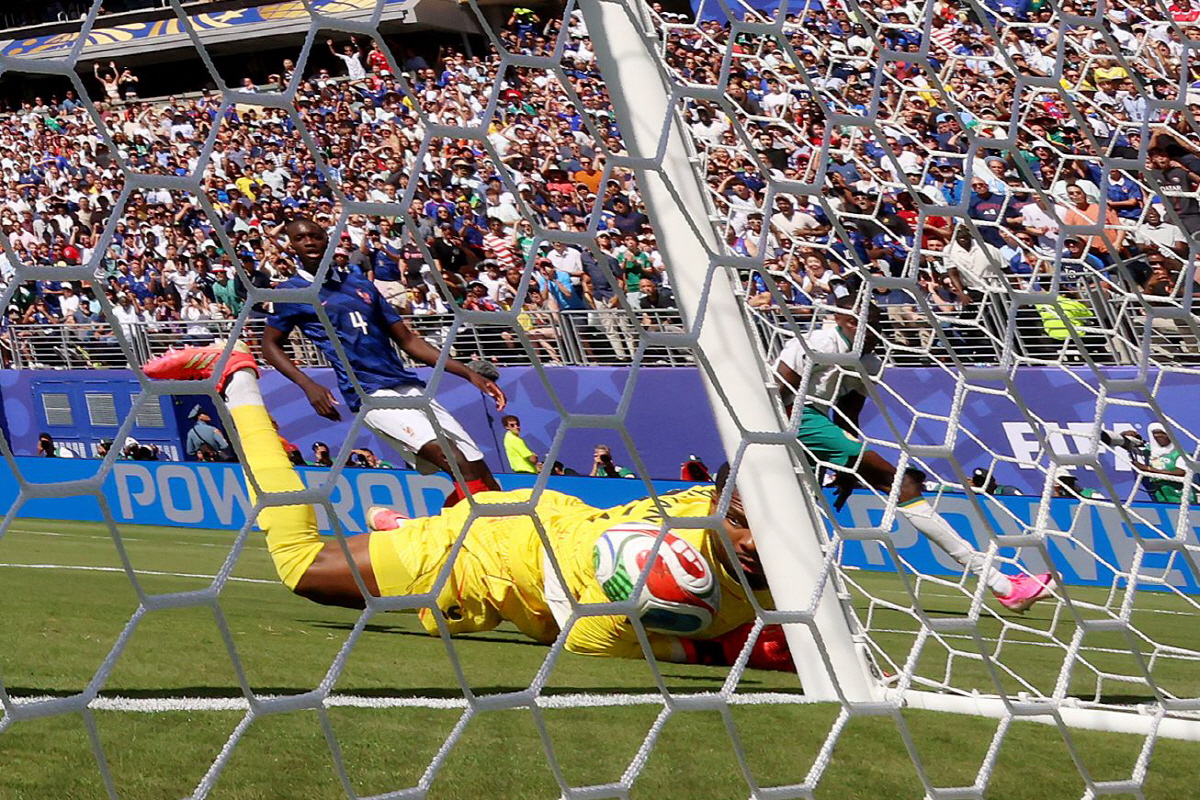 Senegal's goalkeeper #16 Edouard Mendy looks at the ball after hitting the post during the 2026 World Cup Group I football match between France and Senegal at the New York/New Jersey Stadium in East Rutherford on June 16, 2026. (Photo by CHARLY TRIBALLEAU / AFP)