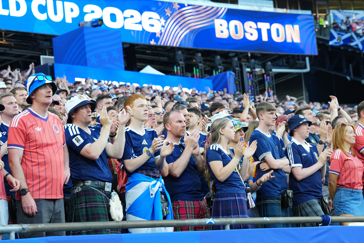 Scotland fans pay tribute to Donny Strathie, a Scotland fan who passed away in the last week, during the World Cup Group C soccer match between Scotland and Morocco in Foxborough, Mass., near Boston, Friday, June 19, 2026. (AP Photo/Martin Meissner)