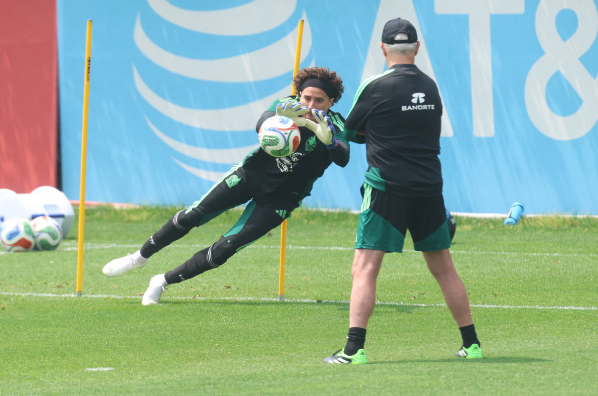 Mexico's goalkeeper Guillermo Ochoa catches the ball during a training session at the high-performance centre in Mexico City May 13, 2026. Mexico will play three friendly matches, against Ghana, Australia and Serbia, before the start of the 2026 FIFA world cup. (Photo by LUIS CORTES / AFP)