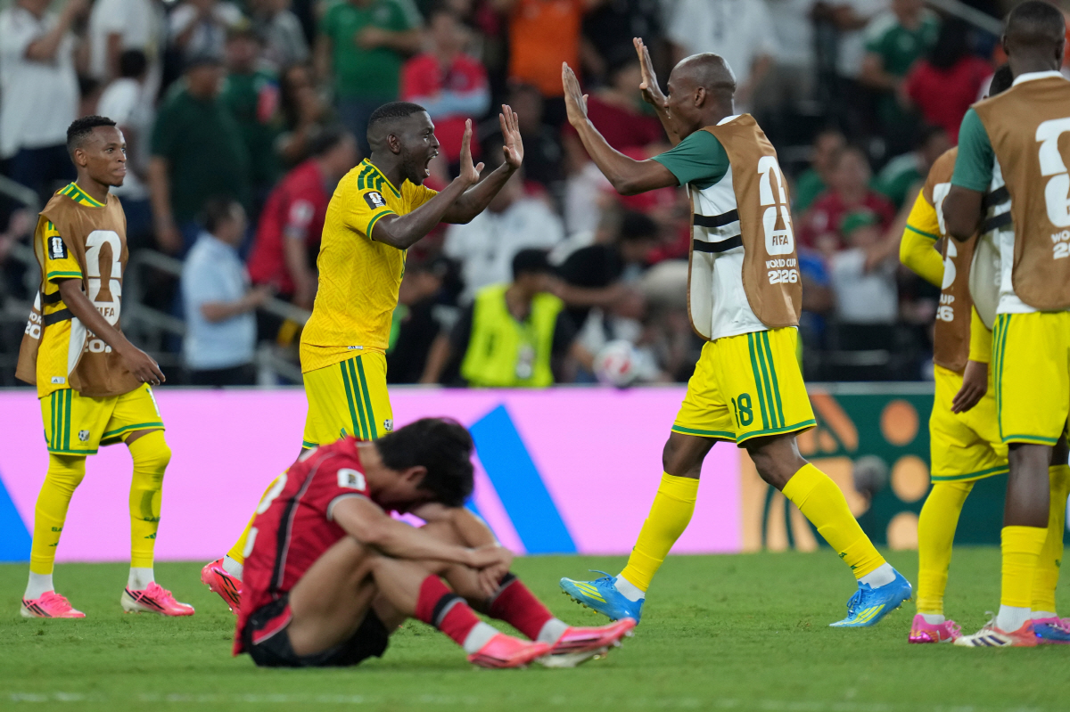 South Africa's Samukelo Kabini (18) celebrates with teammate Aubrey Modiba (6) after the World Cup Group A soccer match between South Africa and South Korea in Guadalupe, near Monterrey, Mexico, Wednesday, June 24, 2026. (AP Photo/Matias Delacroix)