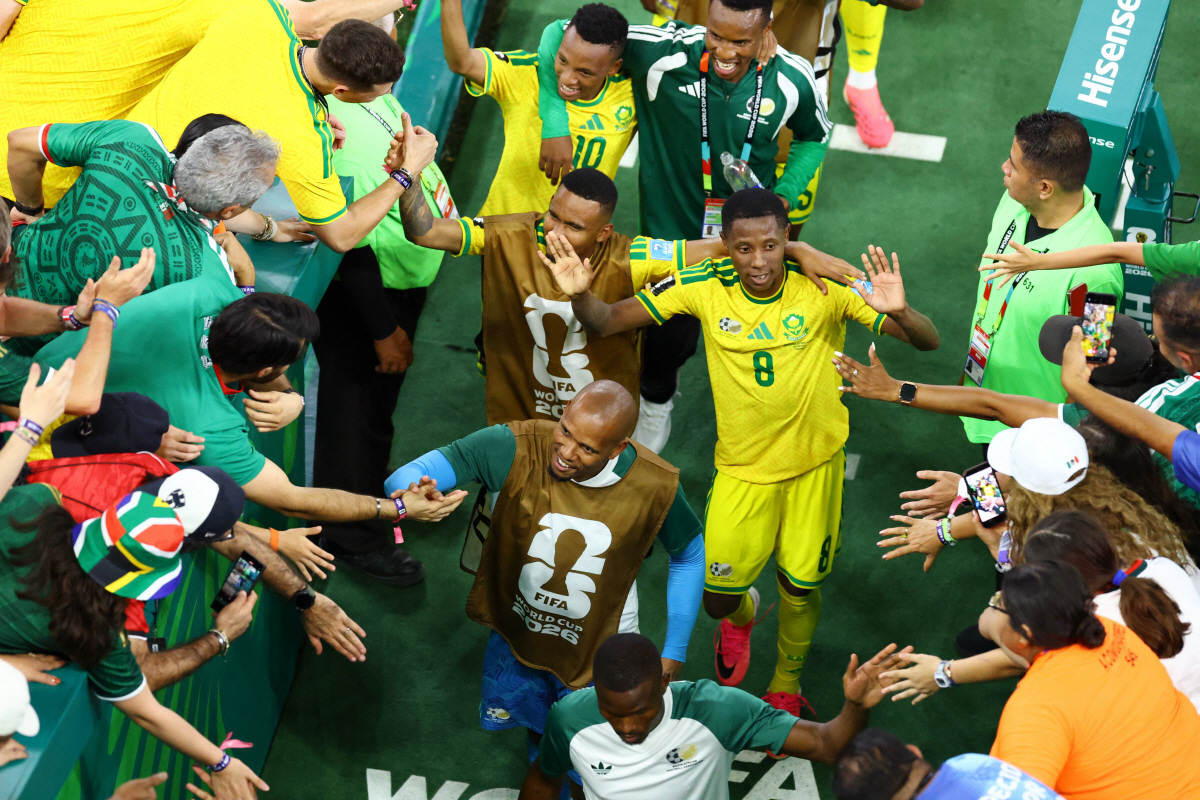 Soccer Football - FIFA World Cup 2026 - Group A - South Africa v South Korea - Estadio Monterrey, Monterrey, Mexico - June 24, 2026 South Africa's Tshepang Moremi celebrates with teammates after the match REUTERS/Raquel Cunha