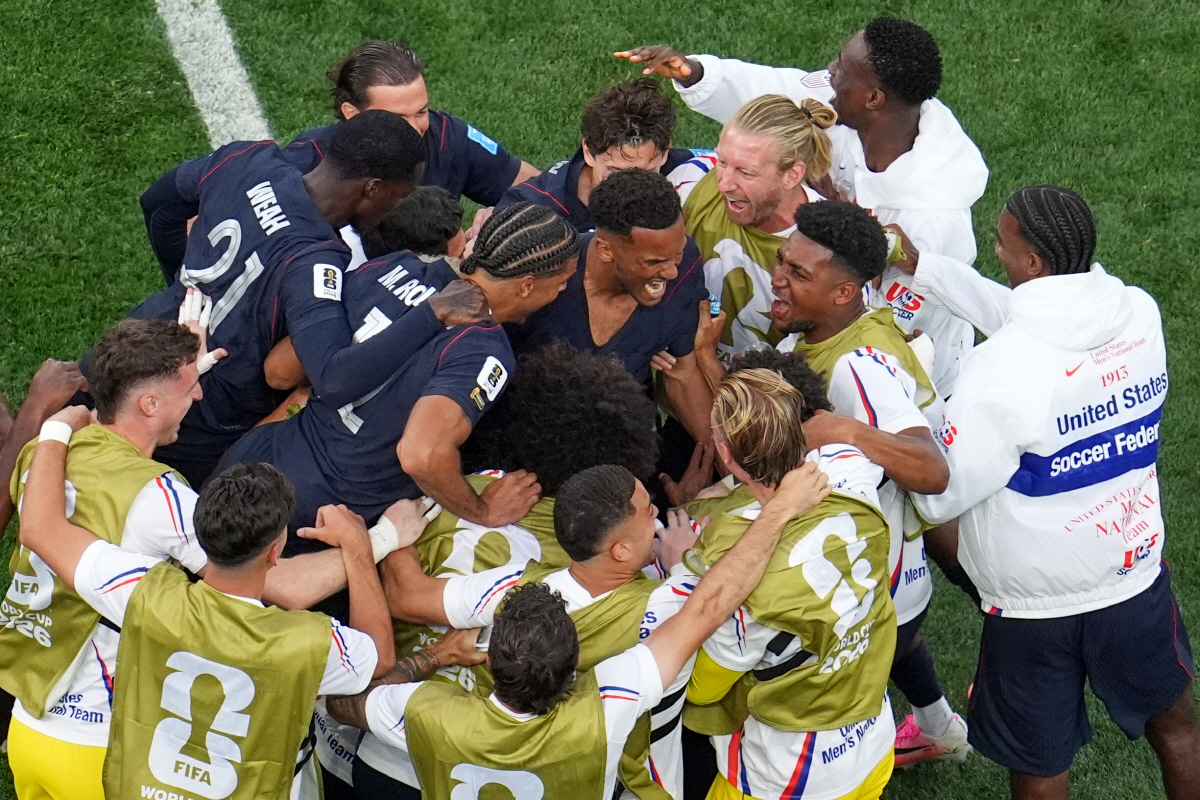 United States' Auston Trusty, center, celebrates with teammates after scoring his side's first goal against Turkey during a World Cup Group D soccer match in Inglewood, Calif., near Los Angeles, Thursday, June 25, 2026. (AP Photo/Marcio J. Sanchez)