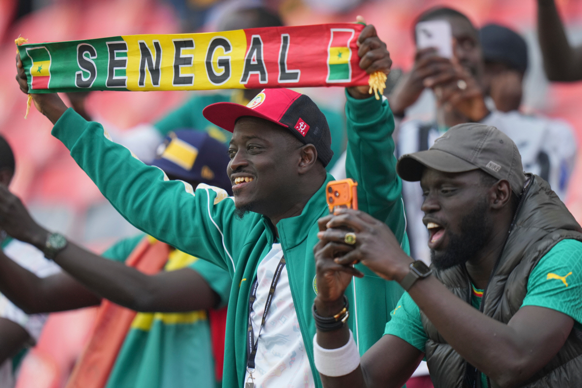 Senegal supporters cheer for their team ahead of the World Cup Group I soccer match between Senegal and Iraq in Toronto, Friday, June 26, 2026. (AP Photo/Stephanie Scarbrough)