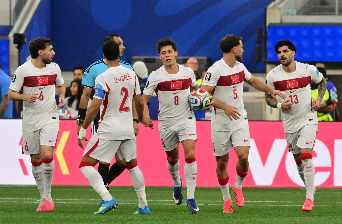 Turkey's midfielder #08 Arda Guler (C) celebrates after scoring his team?s first goal with teammates during the 2026 World Cup Group D football match between Turkey and USA at the Los Angeles Stadium in Inglewood on June 25, 2026. (Photo by Frederic J. BROWN / AFP)