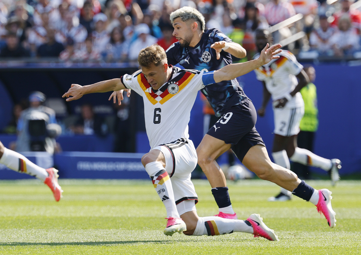 Germany's Joshua Kimmich (6) is tackled by Paraguay's Julio Enciso in the first half of a FIFA World Cup match at Boston Stadium in Boston on Monday, June 29, 2026. Photo by CJ Gunther/UPI