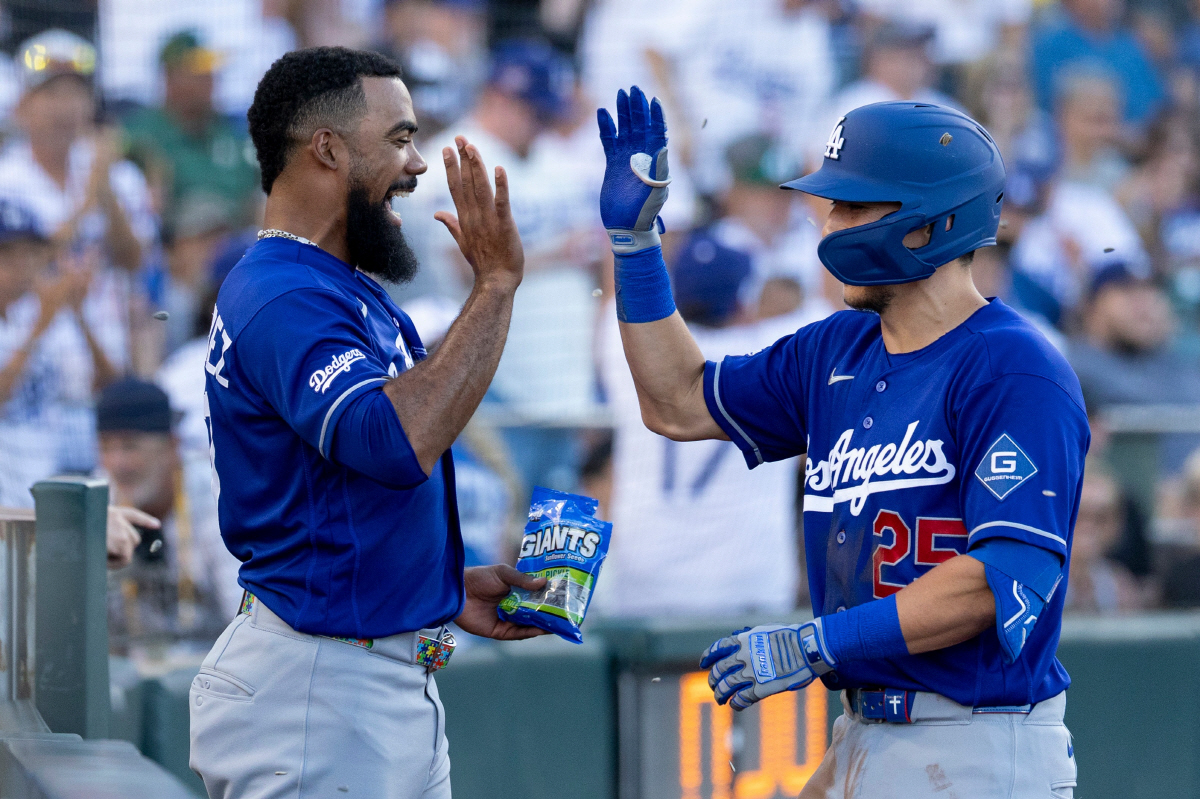 Los Angeles Dodgers' Tommy Edman, right, celebrates with Teoscar Hernandez after hitting a three-run home run during the third inning of a baseball game against the Athletics Tuesday, June 30, 2026, in West Sacramento, Calif. (AP Photo/Sara Nevis)