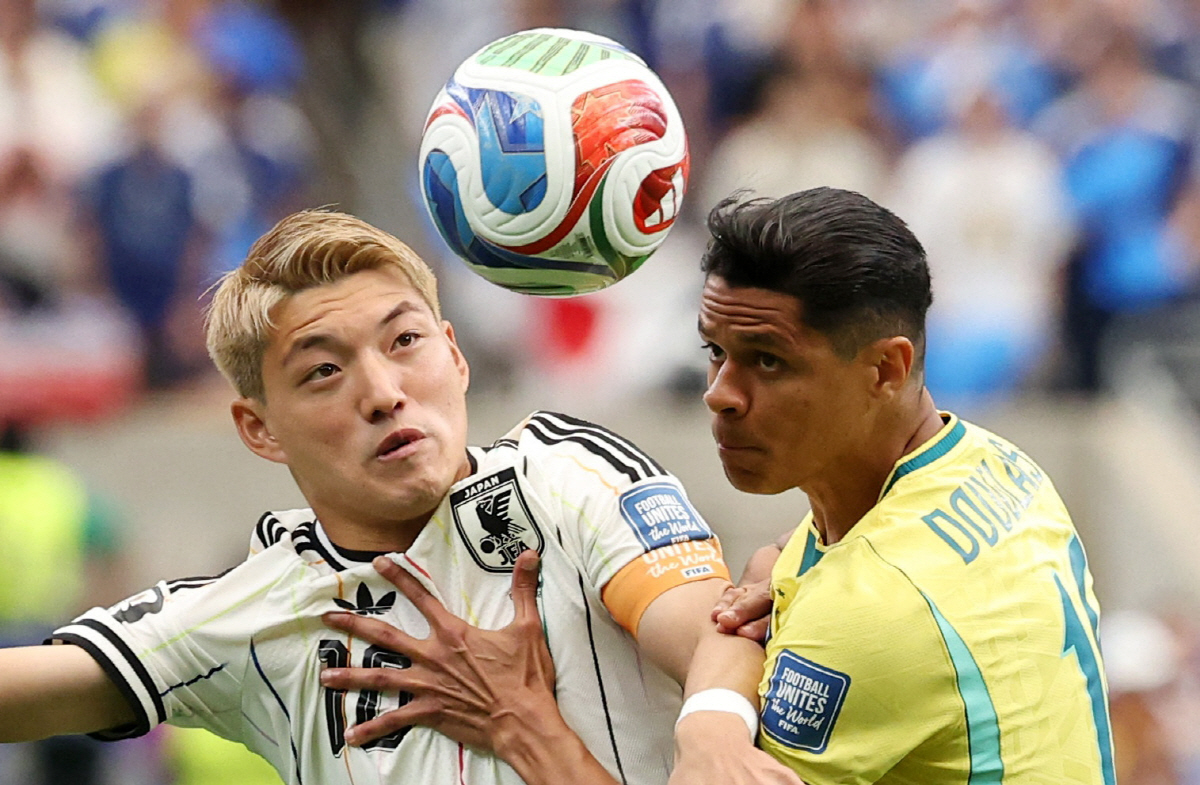 Soccer Football - FIFA World Cup 2026 - Round of 32 - Brazil v Japan - Houston Stadium, Houston, Texas, U.S. - June 29, 2026 Japan's Ritsu Doan in action with Brazil's Douglas Santos IMAGN IMAGES via Reuters/Troy Taormina