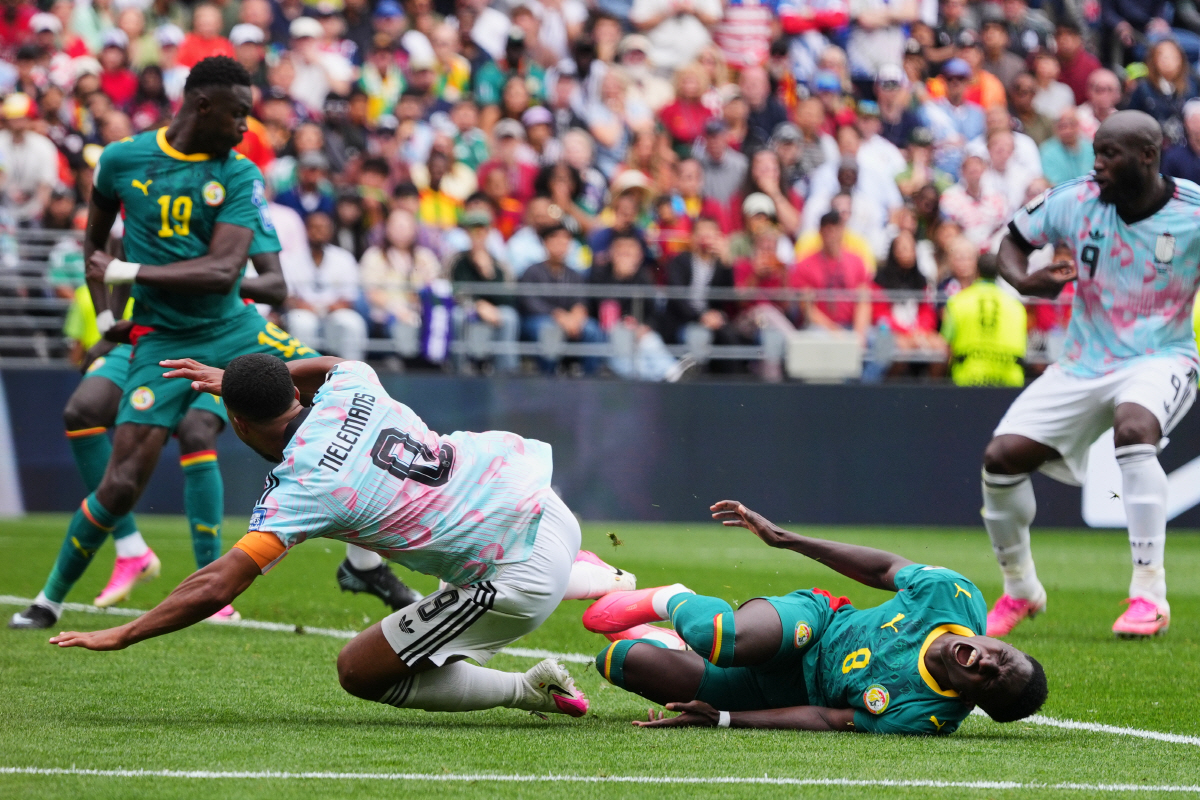 Senegal's Lamine Camara, right, tackles Belgium's Youri Tielemans (8) resulting in a penalty kick for Belgium during the World Cup round of 32 soccer match between Belgium and Senegal in Seattle, Wednesday, July 1, 2026. (AP Photo/Manu Fernandez)