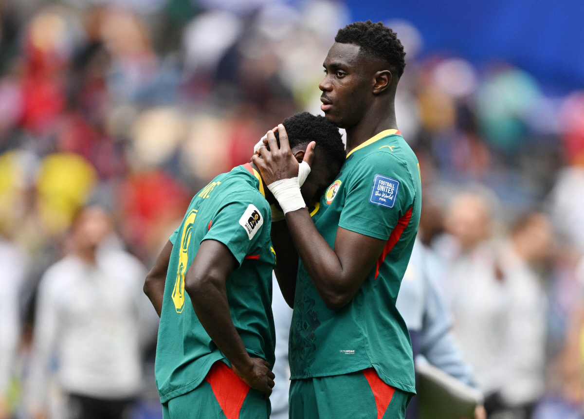 Soccer Football - FIFA World Cup 2026 - Round of 32 - Belgium v Senegal - Seattle Stadium, Seattle, Washington, U.S. - July 1, 2026 Senegal's Lamine Camara and Moussa Niakhate look dejected after the match as Senegal are eliminated from the World Cup IMAGN IMAGES via Reuters/Troy Wayrynen
