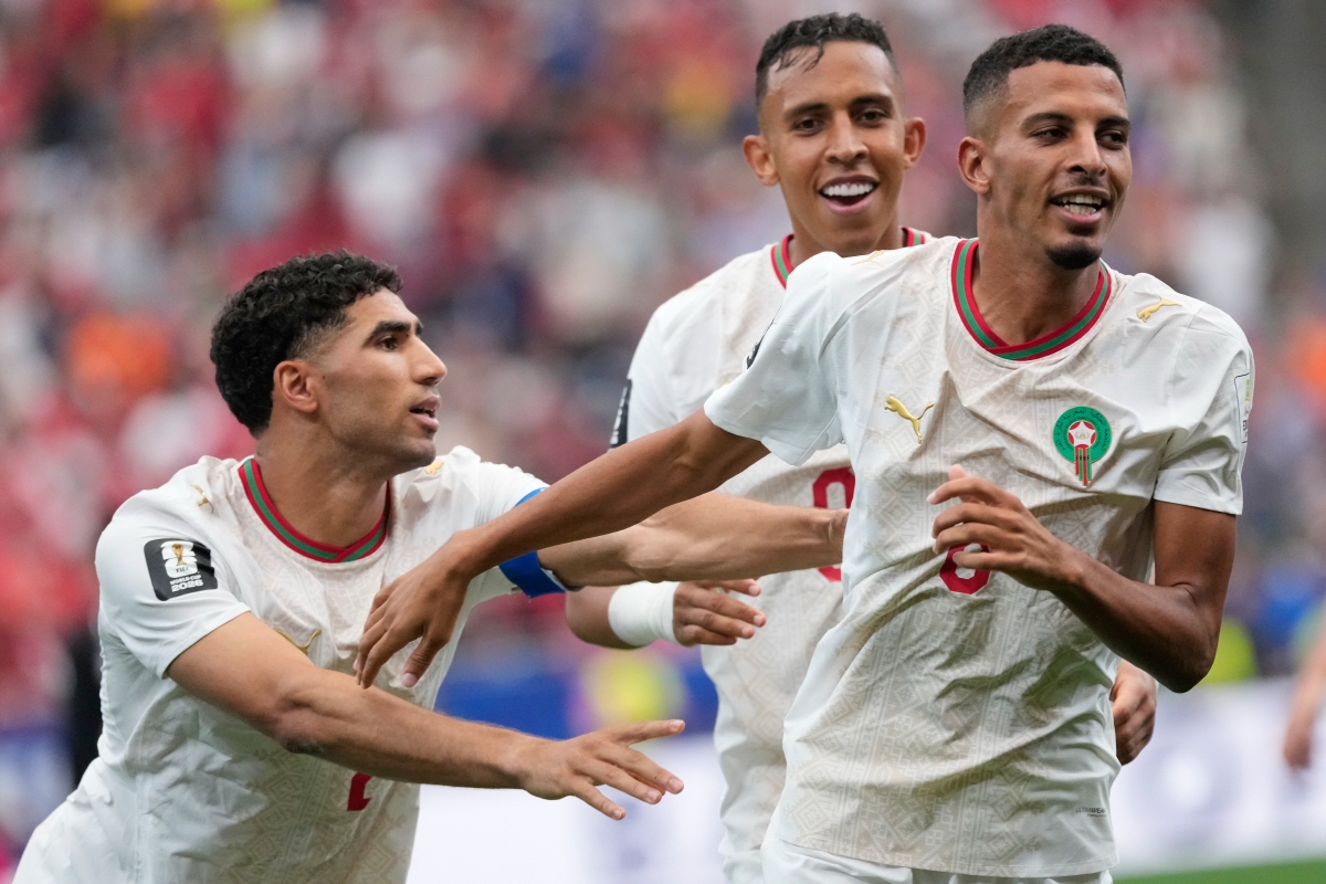 Morocco's Azzedine Ounahi, right, celebrates after scoring the opening goal against Canada during the World Cup round of 16 soccer match in Houston, Saturday, July 4, 2026. (AP Photo/David J. Phillip)