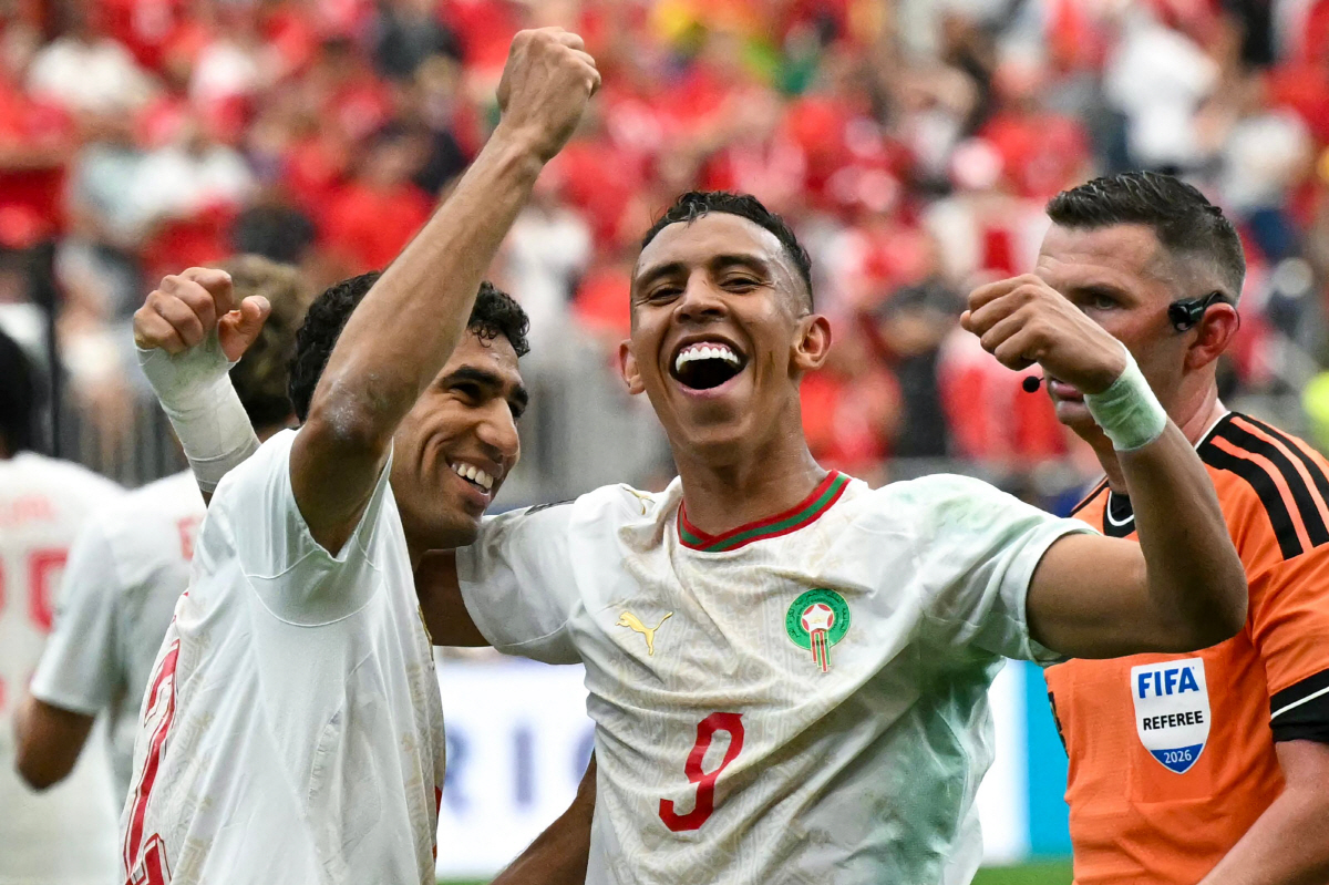Morocco's defender #02 Achraf Hakimi and Morocco's forward #09 Soufiane Rahimi celebrate after winning the 2026 World Cup round of 16 football match between Canada and Morocco at the Houston Stadium in Houston on July 4, 2026. (Photo by RONALDO SCHEMIDT / AFP)