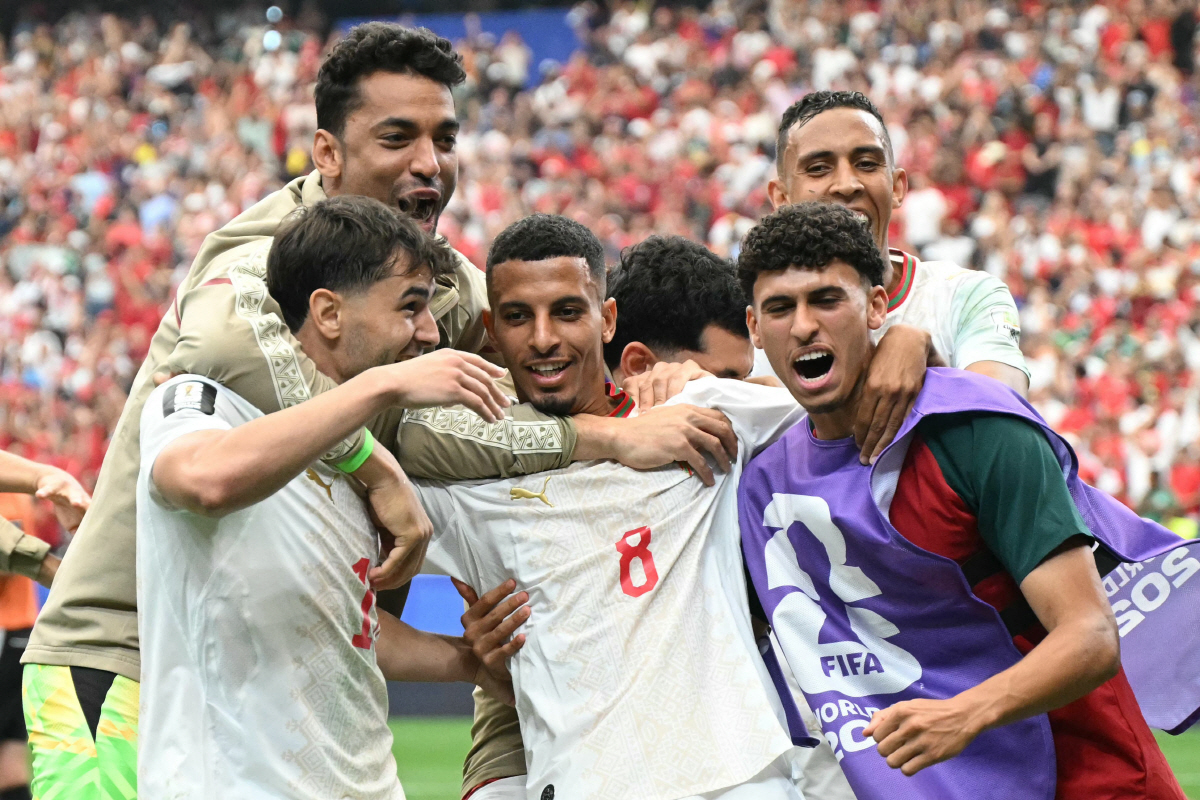 TOPSHOT - Morocco's midfielder #08 Azzedine Ounahi celebrates scoring his team's second goal with teammates during the 2026 World Cup round of 16 football match between Canada and Morocco at the Houston Stadium in Houston on July 4, 2026. (Photo by RONALDO SCHEMIDT / AFP)
