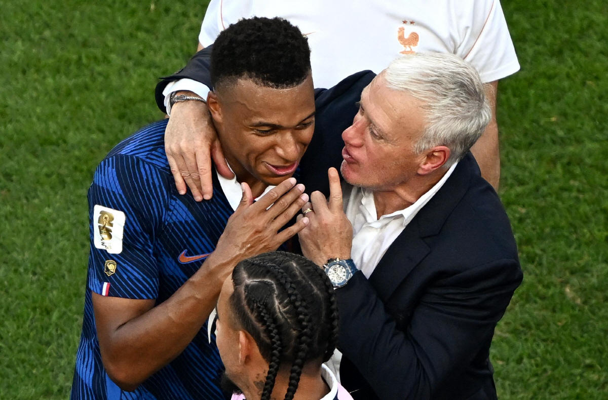France's forward #10 Kylian Mbappe celebrates with his coach Didier Deschamps after winning the 2026 World Cup round of 16 football match between Paraguay and France at the Philadelphia Stadium in Philadelphia on July 4, 2026. (Photo by Jewel SAMAD / AFP)