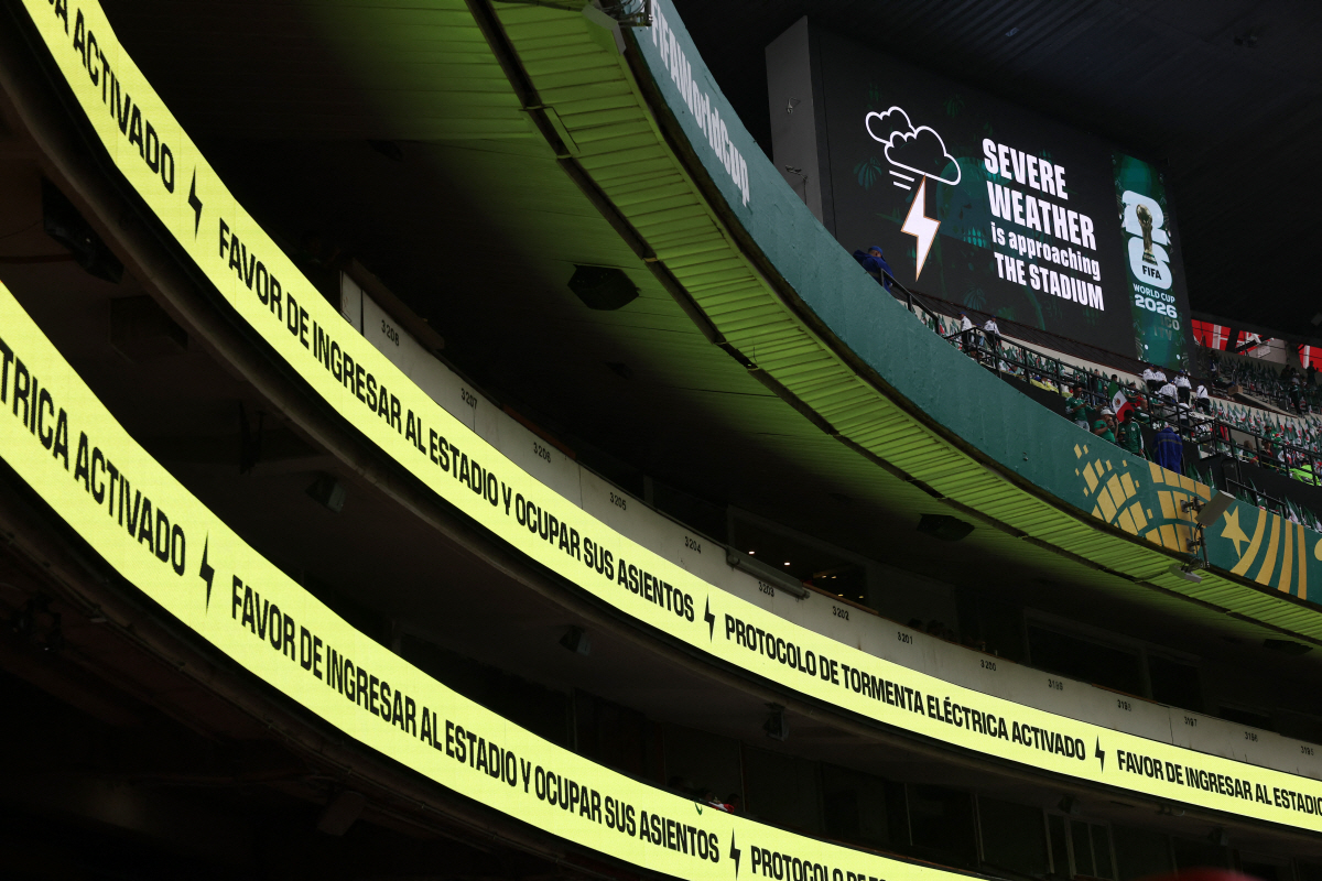 Soccer Football - FIFA World Cup 2026 - Round of 16 - Mexico v England - Estadio Azteca, Mexico City, Mexico - July 5, 2026 General view as a weather warning is displayed on the big screen inside the stadium before the match REUTERS/Paul Childs