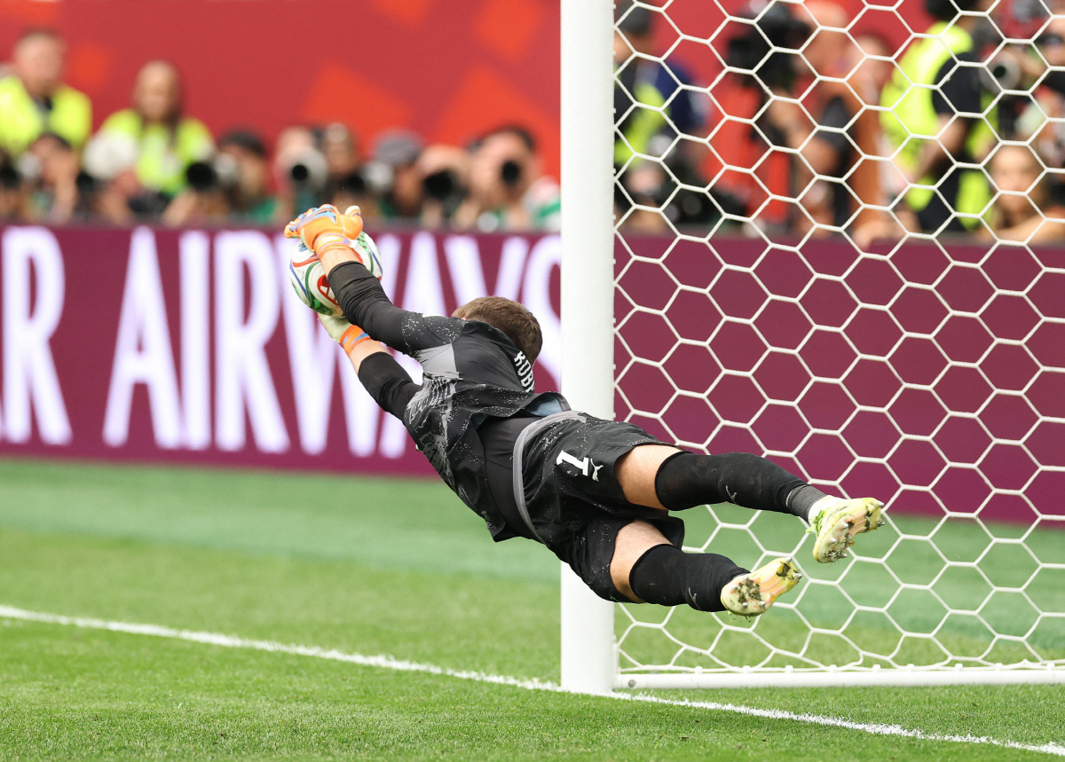 Gregor Kobel #1 of Switzerland saves the Colombia's third fourth penalty taken by Cucho Hernandez