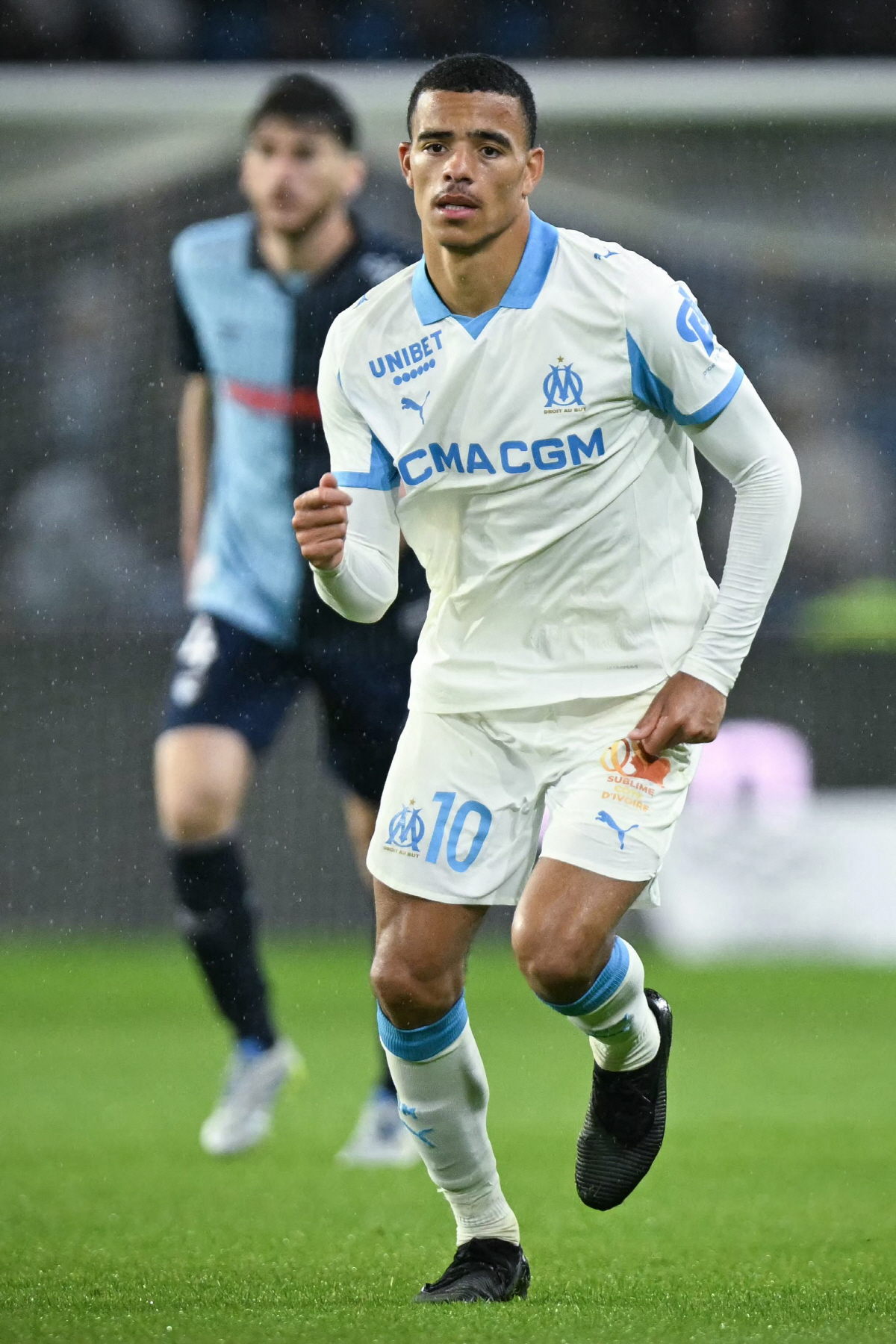 Marseille's English forward #10 Mason Greenwood reacts after scoring during the French L1 football match between Le Havre AC and Olympique de Marseille (OM) at the Stade Oceane in Le Havre, northwestern France, on May 10, 2026. (Photo by LOU BENOIST / AFP)