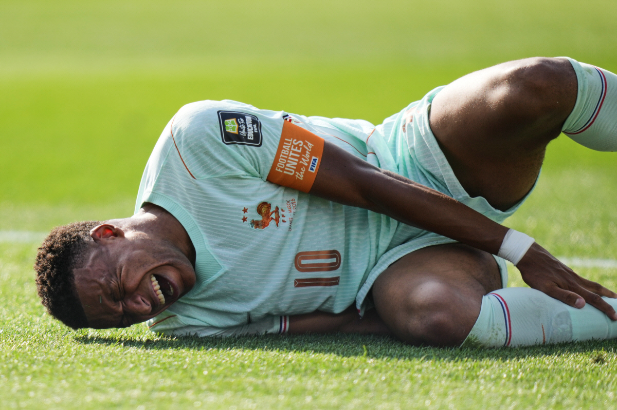 France's Kylian Mbappe (10) reacts to being tripped during the World Cup quarterfinal soccer match between France and Morocco in Foxborough, Mass., near Boston, Thursday, July 9, 2026. (AP Photo/Stephanie Scarbrough)