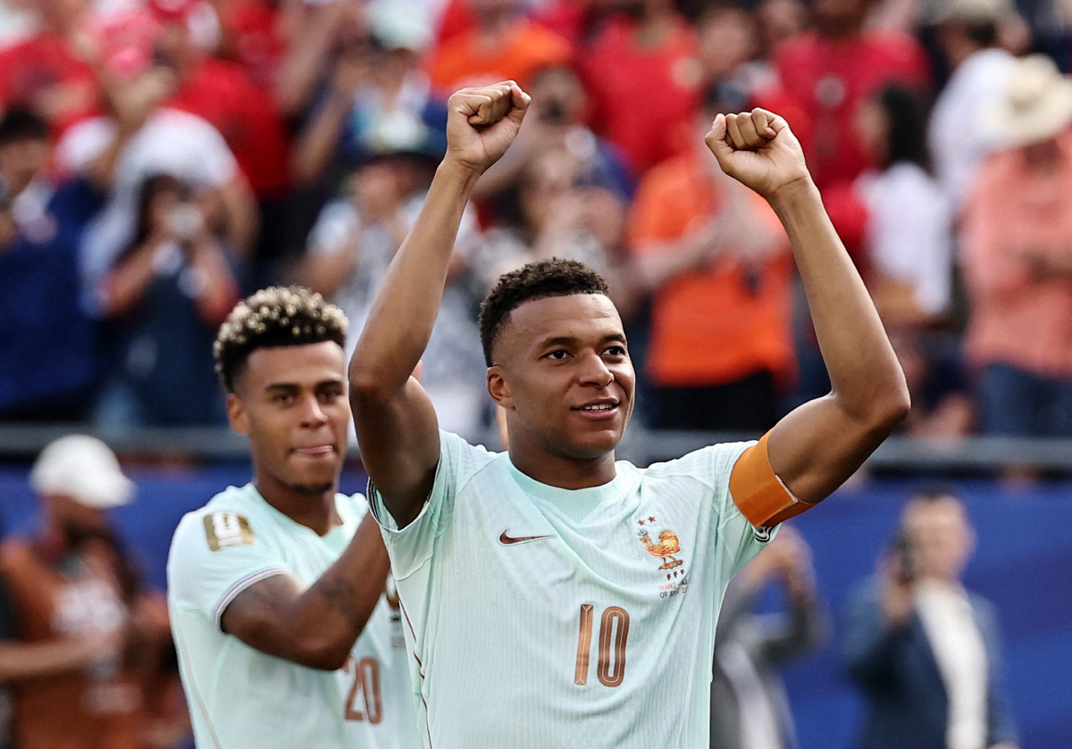 Soccer Football - FIFA World Cup 2026 - Quarter Final - France v Morocco - Boston Stadium, Foxborough, Massachusetts, U.S. - July 9, 2026 France's Desire Doue and France's Kylian Mbappe celebrate after the match as France qualify for the semi final stage of the World Cup REUTERS/Winslow Townson