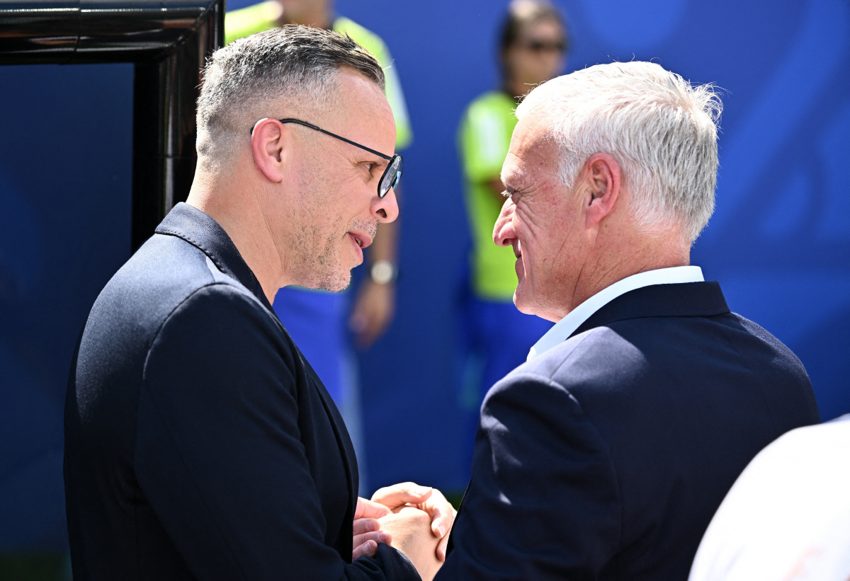 Soccer Football - FIFA World Cup 2026 - Quarter Final - France v Morocco - Boston Stadium, Foxborough, Massachusetts, U.S. - July 9, 2026 Morocco coach Mohamed Ouahbi with France coach Didier Deschamps before the match REUTERS/Dylan Martinez