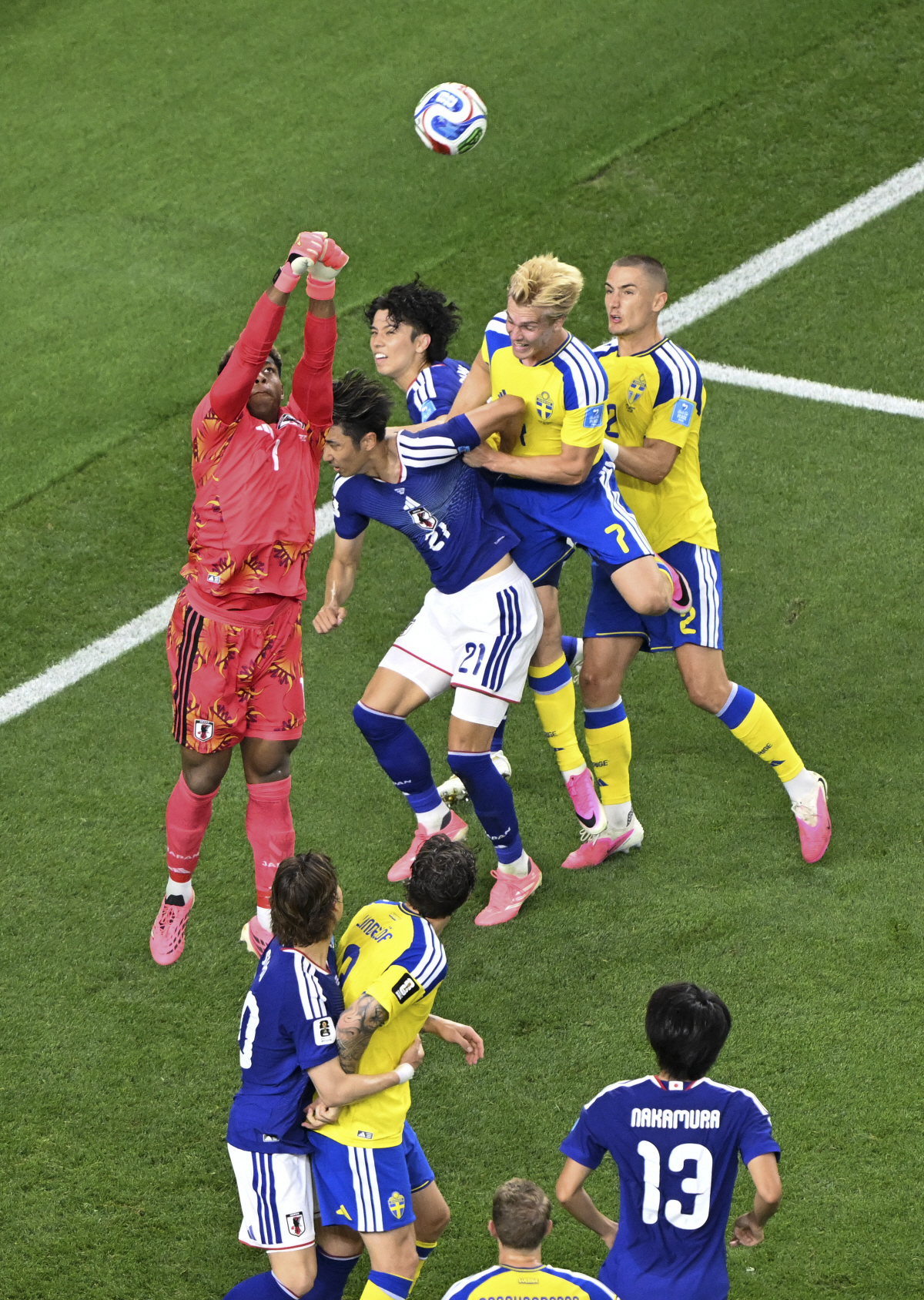 (260626) -- DALLAS, June 26, 2026 (Xinhua) -- Suzuki Zion (1st L), goalkeeper of Japan, jumps to save the ball during the group F match between Japan and Sweden at the 2026 FIFA World Cup at Dallas Stadium in Dallas, the United States, on June 25, 2026. (Xinhua/Cheng Min)