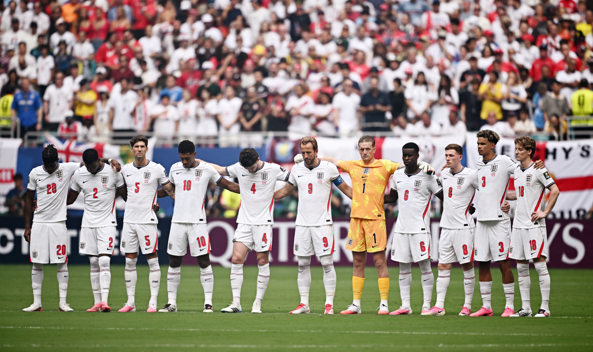 Soccer Football - FIFA World Cup 2026 - Quarter Final - Norway v England - Miami Stadium, Miami Gardens, Florida, U.S. - July 11, 2026 England players stand during a minutes silence in memory of South African's Jayden Adams before the match REUTERS/Dylan Martinez