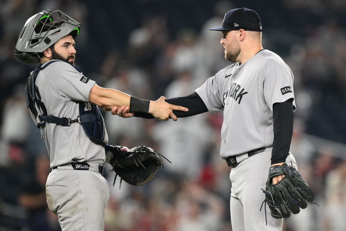 New York Yankees' catcher Austin Wells, left, and relief pitcher David Bednar, right, celebrate after a baseball game against the Washington Nationals, Friday, July 10, 2026, in Washington. (AP Photo/Nick Wass)