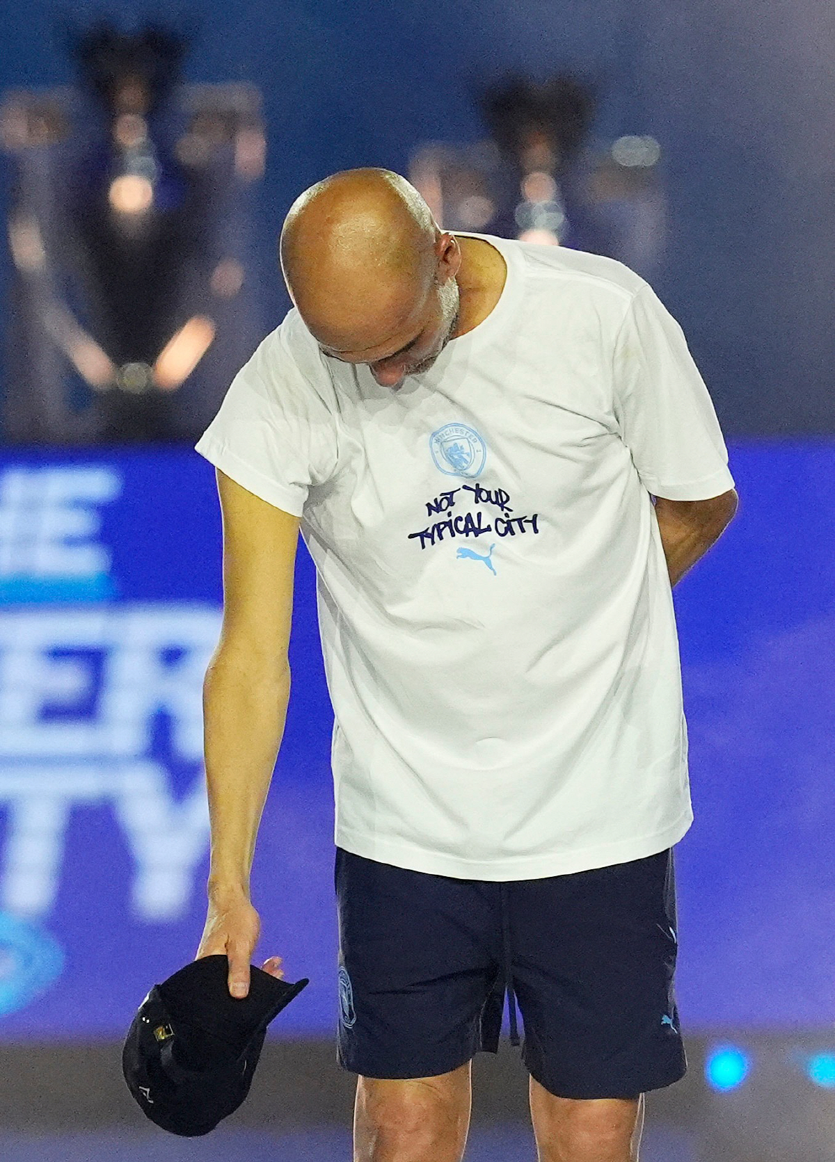 Manchester City manager Pep Guardiola bows to the crowd during a stage event following a parade to celebrate the achievements of the Manchester City men's and women's teams this season in Manchester, England, Monday, May 25, 2026. (Nick Potts/PA via AP) UNITED KINGDOM OUT; NO SALES; NO ARCHIVE; PHOTOGRAPH MAY NOT BE STORED OR USED FOR MORE THAN 14 DAYS AFTER THE DAY OF TRANSMISSION; MANDATORY CREDIT