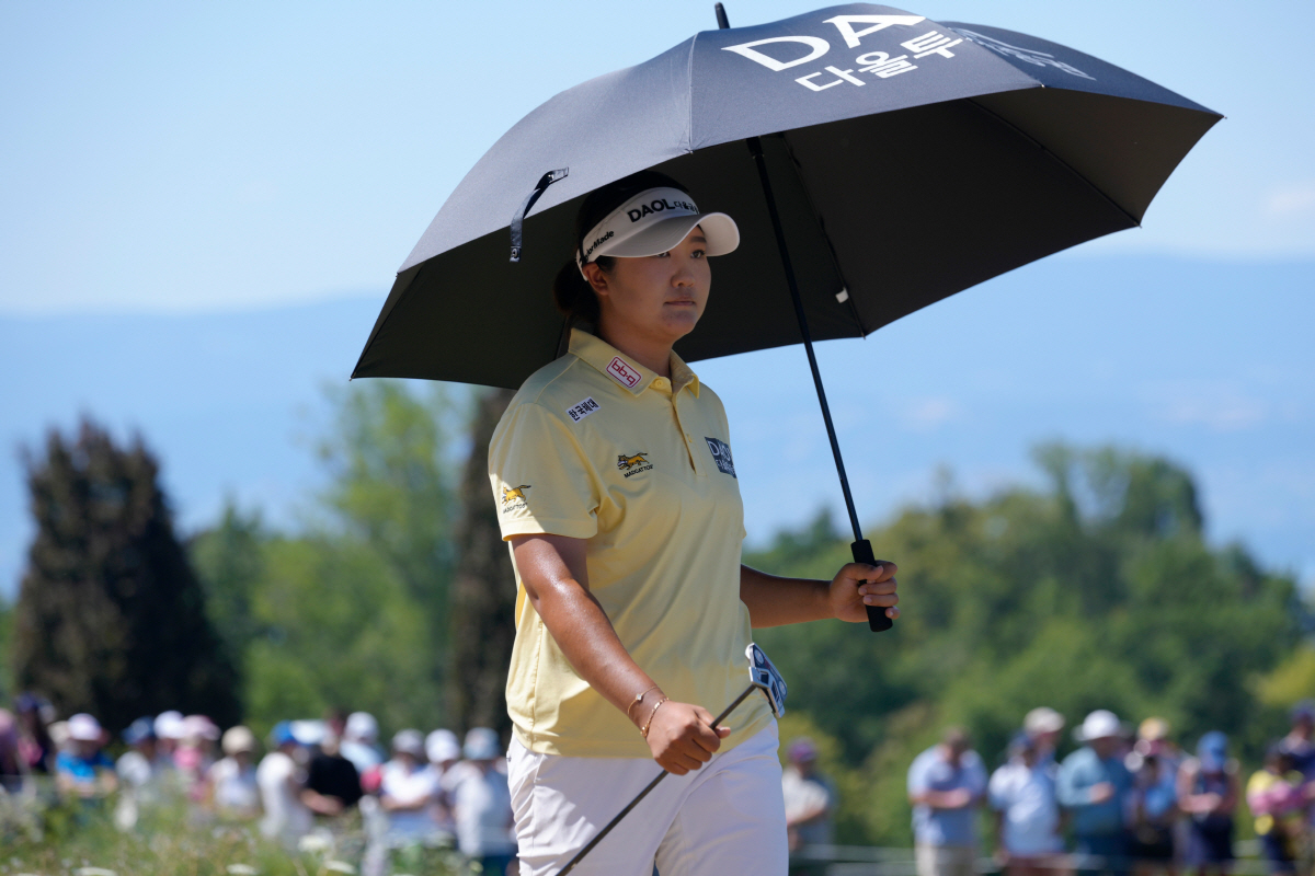 Haeran Ryu, of South Korea, walks on the 16th hole during the Evian Championship women's golf tournament, in Evian, eastern France, Sunday, July 12, 2026. (AP Photo/Laurent Cipriani)
