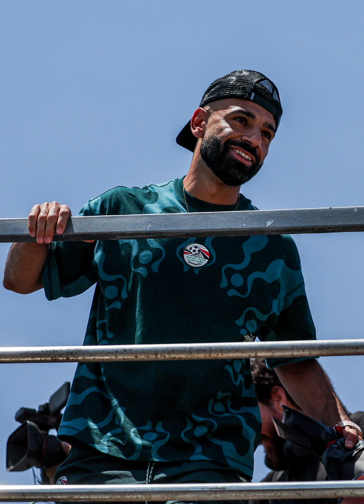 Egypt's Mohamed Salah looks at the crowd from a bus as Egypt's national team is welcomed by fans at El Alamein International Airport upon its return from the 2026 FIFA World Cup, ahead of an official reception by President Abdel Fattah al-Sisi, in El Dabaa, Egypt, July 10, 2026. REUTERS/Mohamed Abdel Ghany