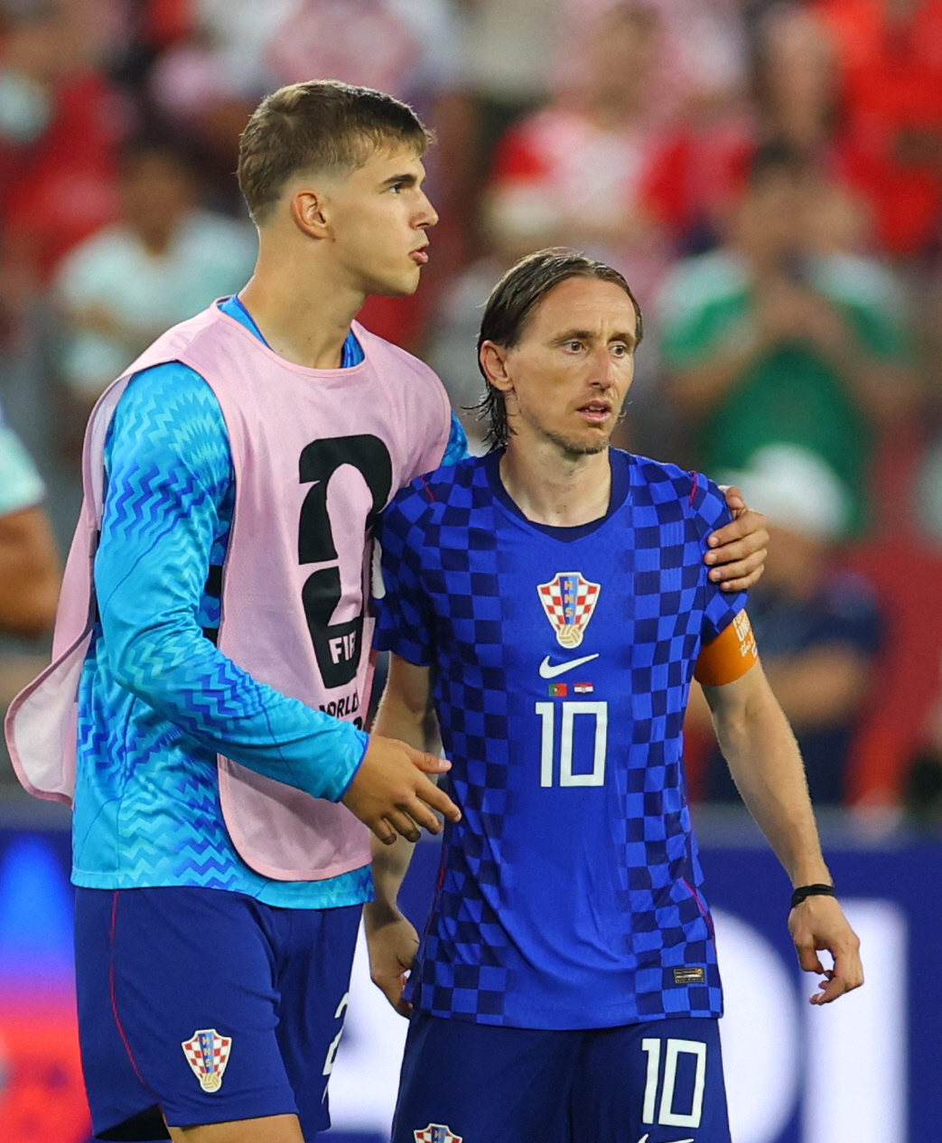 Soccer Football - FIFA World Cup 2026 - Round of 32 - Portugal v Croatia - Toronto Stadium, Toronto, Canada - July 2, 2026 Croatia's Luka Modric with Luka Vuskovic as he looks dejected after the match following their elimination from the World Cup REUTERS/Mike Segar