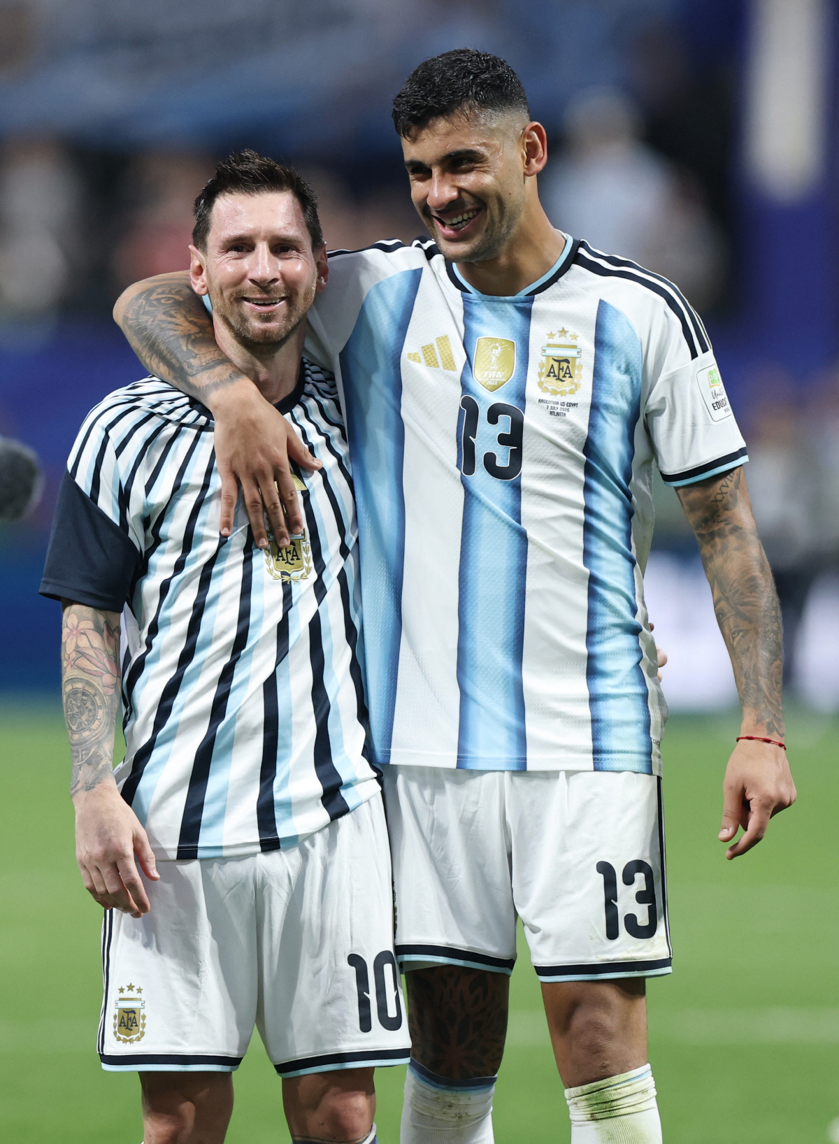 Soccer Football - FIFA World Cup 2026 - Round of 16 - Argentina v Egypt - Atlanta Stadium, Atlanta, Georgia, U.S. - July 7, 2026 Argentina's Lionel Messi and Cristian Romero celebrate after the match as Argentina qualify for the quarter finals of the World Cup REUTERS/Amanda Perobelli
