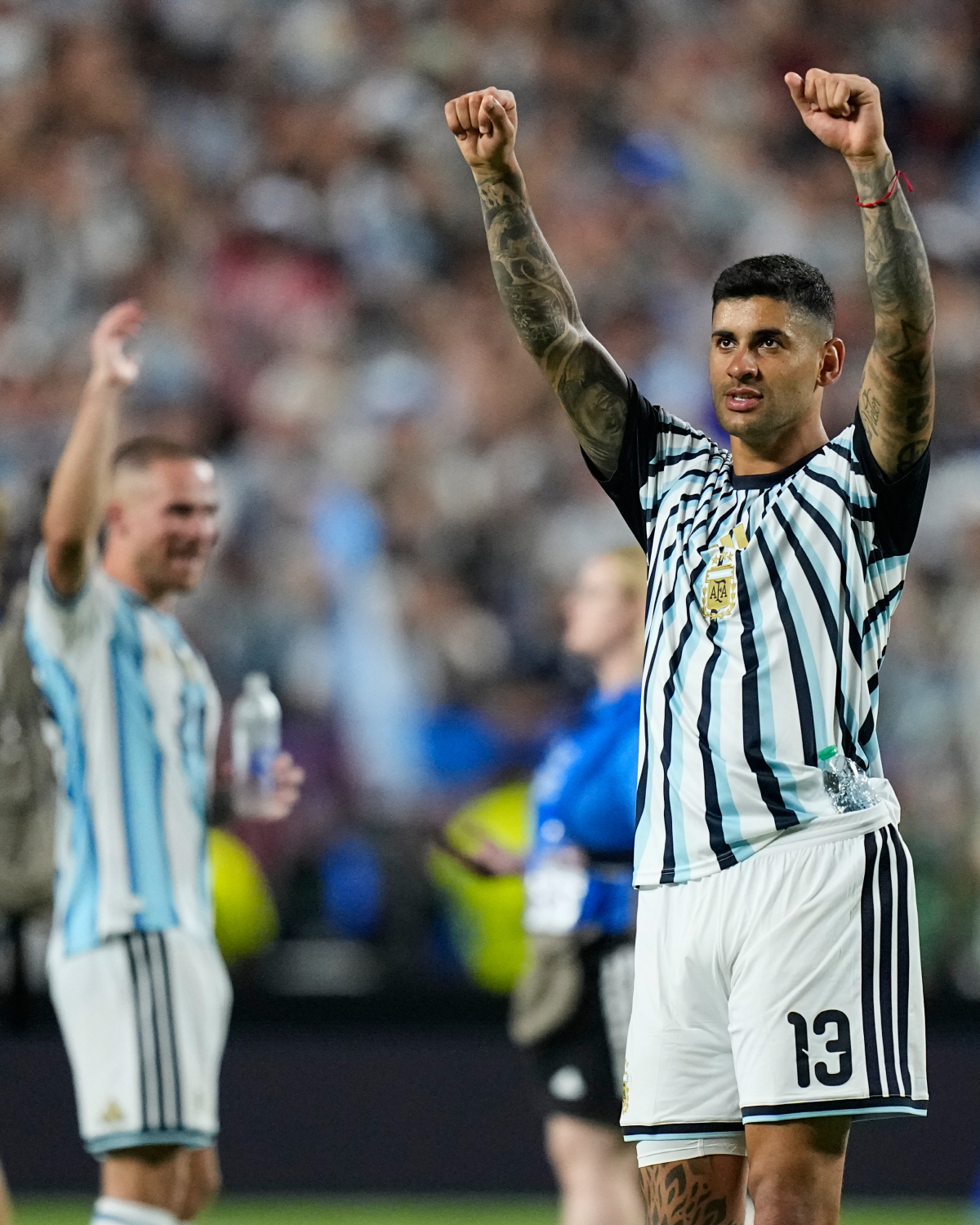 Argentina's Cristian Romero (13) celebrates following the World Cup quarterfinal soccer match between Argentina and Switzerland in Kansas City, Mo., Saturday, July 11, 2026. (AP Photo/Ashley Landis)