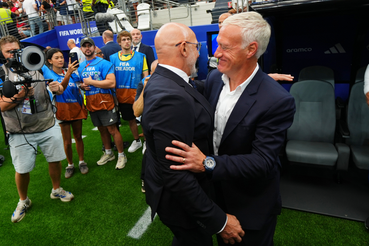 France head coach Didier Deschamps, right, and Spain head coach Luis de la Fuente embrace ahead a World Cup semifinal soccer match between France and Spain in Arlington, Texas, near Dallas, Tuesday, July 14, 2026. (AP Photo/Julio Cortez)