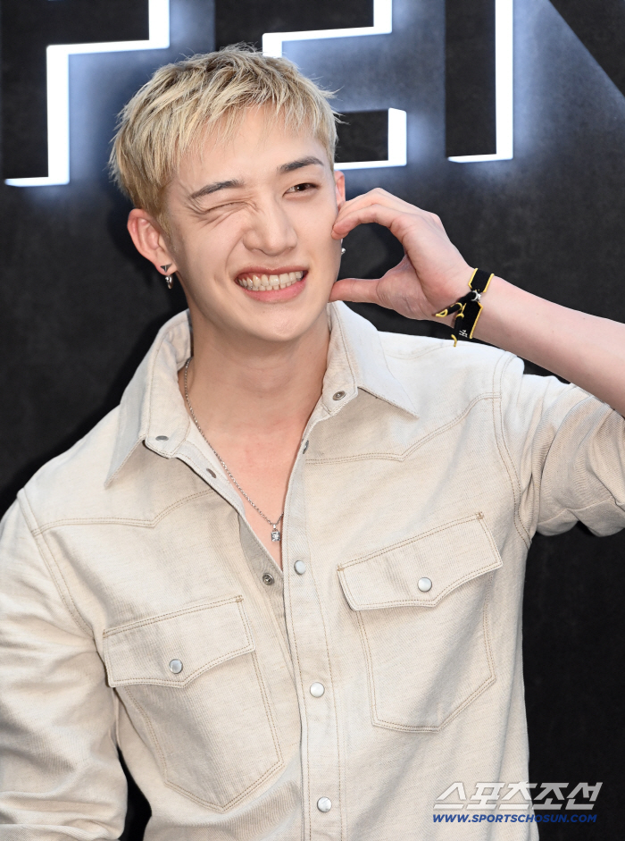 Stray Kids' Bang Chan Winks and Makes a Finger Heart