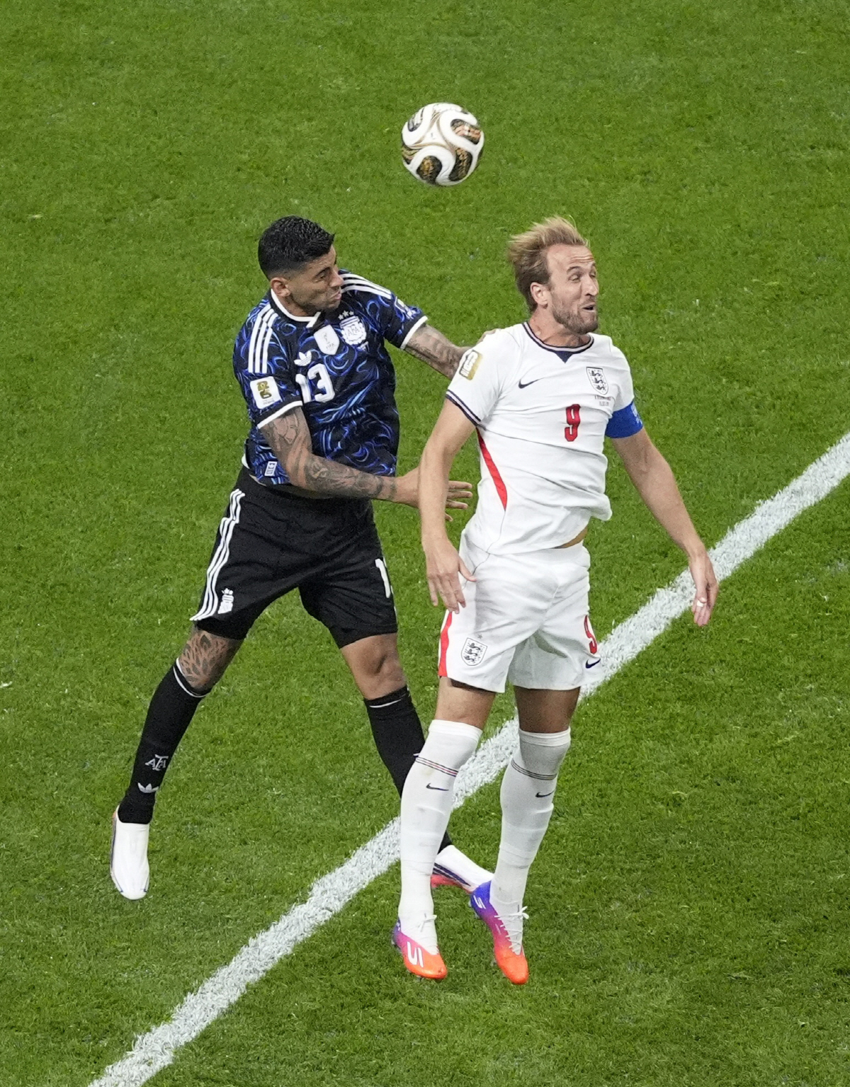 Soccer Football - FIFA World Cup 2026 - Semi Final - England v Argentina - Atlanta Stadium, Atlanta, Georgia, U.S. - July 15, 2026 Argentina's Cristian Romero in action with England's Harry Kane IMAGN IMAGES via Reuters/Dale Zanine