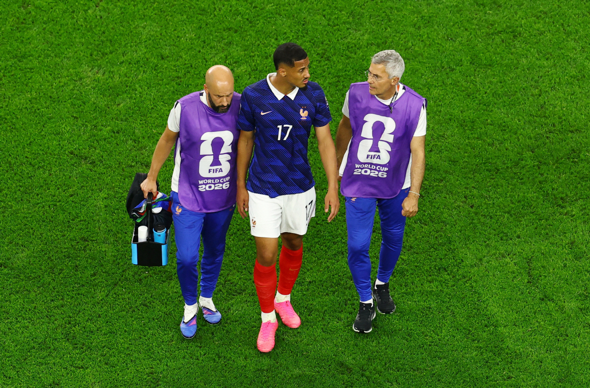 Soccer Football - FIFA World Cup 2026 - Semi Final - France v Spain - Dallas Stadium, Arlington, Texas, U.S. - July 14, 2026 France's William Saliba is escorted off the pitch by medical staff after sustaining an injury REUTERS/Marco Bello