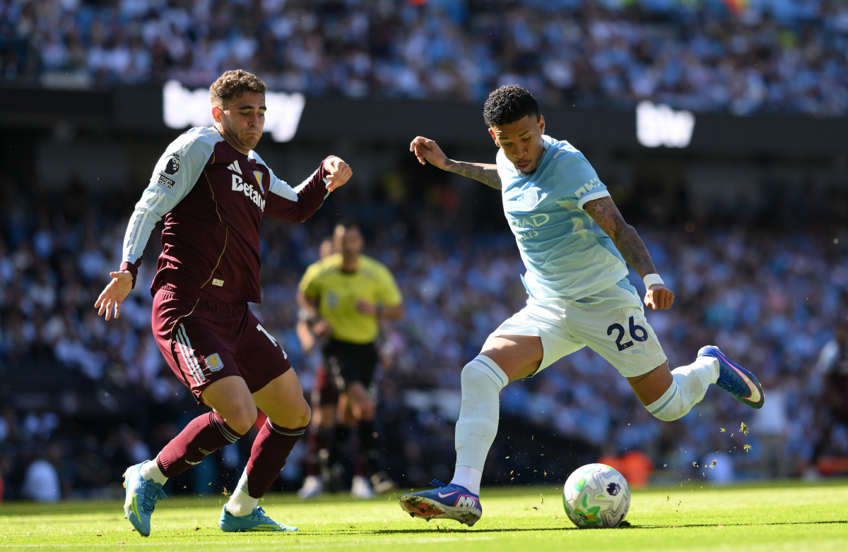 epa12990675 Manchester City's Savinho (R) in action against Aston Villa's Andres Garcia (L) during the English Premier League match Manchester City against Aston Villa, in Manchester, Britain, 24 May 2026. EPA/GARY OAKLEY EDITORIAL USE ONLY. No use with unauthorized audio, video, data, fixture lists, club/league logos, 'live' services or NFTs. Online in-match use limited to 120 images, no video emulation. No use in betting, games or single club/league/player publications.