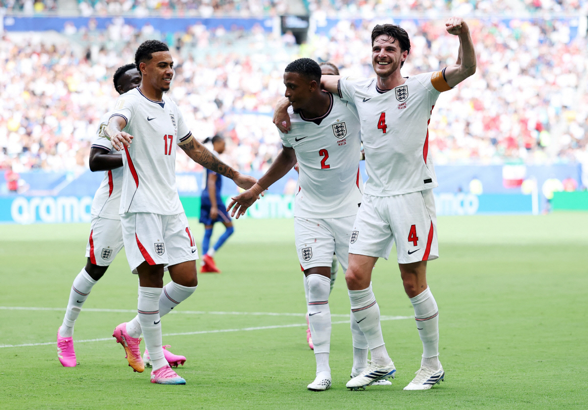 MIAMI GARDENS, FLORIDA - JULY 18: Ezri Konsa #2 of England celebrates with teammates Morgan Rogers #17 and Declan Rice #4 after scoring his team's second goal during the FIFA World Cup 2026 Bronze Final between France and England at Miami Stadium on July 18, 2026 in Miami Gardens, Florida. Buda Mendes/Getty Images/AFP (Photo by Buda Mendes / GETTY IMAGES NORTH AMERICA / Getty Images via AFP)