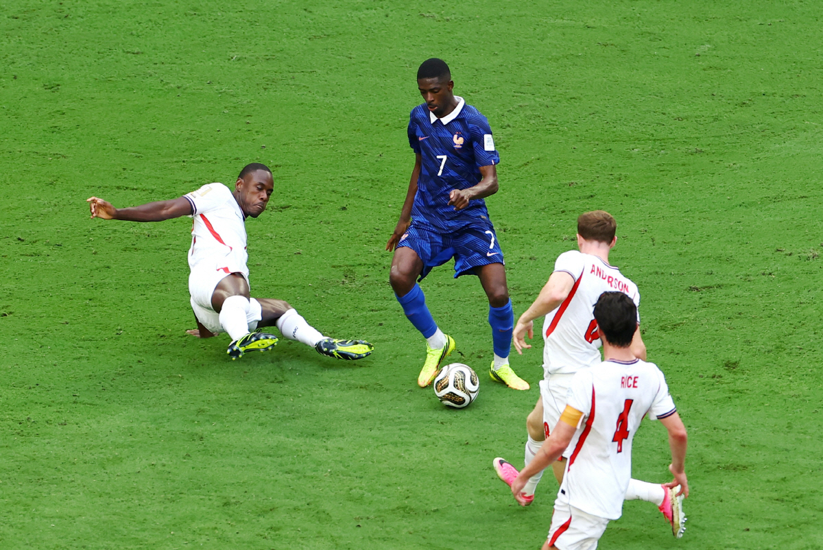 Soccer Football - FIFA World Cup 2026 - Bronze Final - France v England - Miami Stadium, Miami Gardens, Florida, U.S. - July 18, 2026 France's Ousmane Dembele in action with England's Trevoh Chalobah and Elliot Anderson before he scores their fourth goal REUTERS/Marco Bello