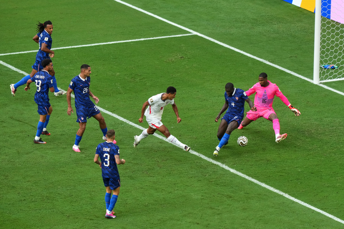 England's Jude Bellingham (10) shoots the ball past France's Dayot Upamecano (4) and goalkeeper Mike Maignan (16) to score their sixth goal during the World Cup third-place playoff soccer match between France and England in Miami Gardens, Fla., Saturday, July 18, 2026. (AP Photo/Marta Lavandier)