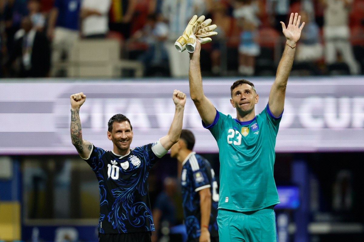 Argentina's Lionel Messi (10) and goalkeeper Emiliano Martinez (23) celebrate after the World Cup semifinal soccer match between England and Argentina in Atlanta, Wednesday, July 15, 2026. (AP Photo/Erik S. Lesser)