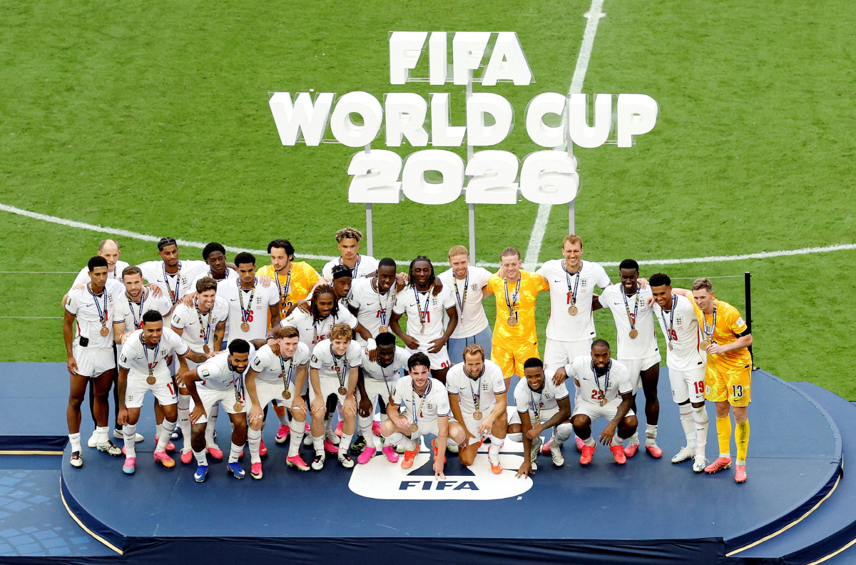 Soccer Football - FIFA World Cup 2026 - Bronze Final - France v England - Miami Stadium, Miami Gardens, Florida, U.S. - July 18, 2026 England manager Thomas Tuchel and England players wear their bronze medals as they pose for a picture on the podium during the ceremony after the match REUTERS/Marco Bello TPX IMAGES OF THE DAY