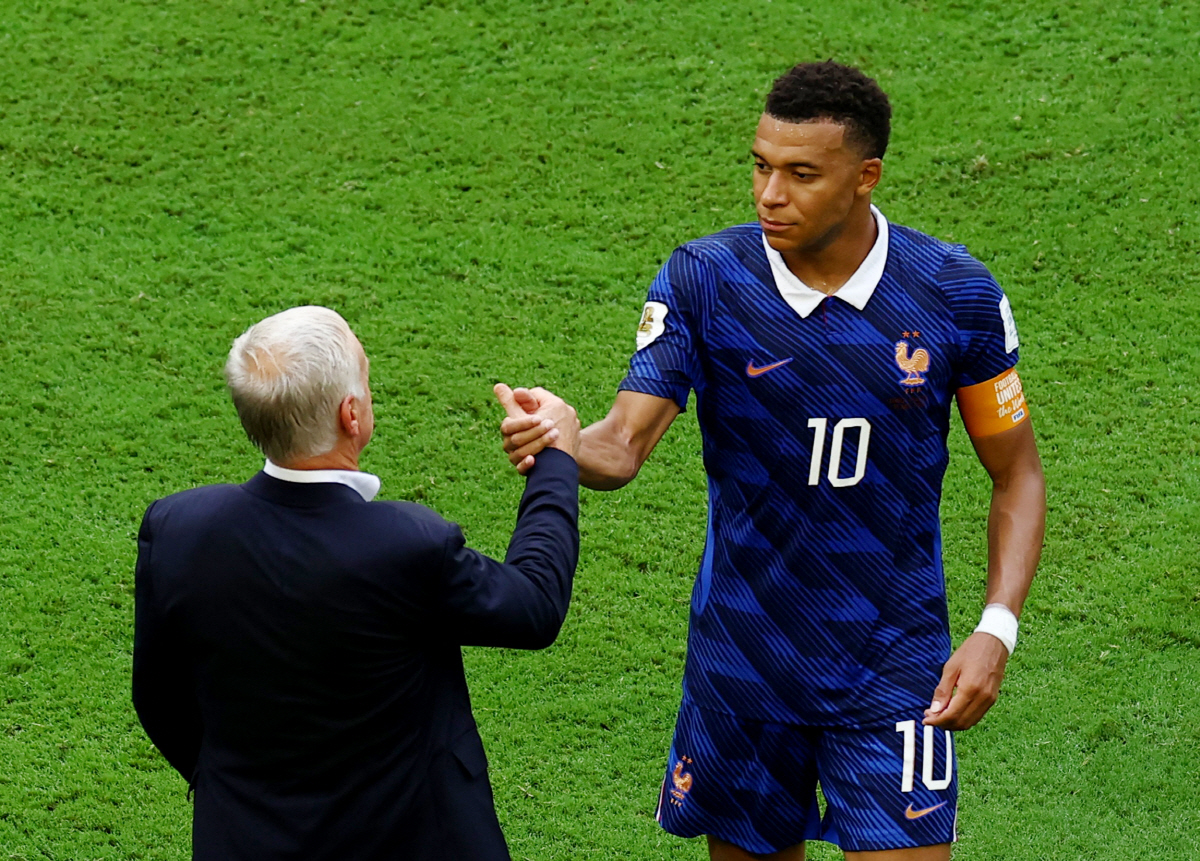 Soccer Football - FIFA World Cup 2026 - Bronze Final - France v England - Miami Stadium, Miami Gardens, Florida, U.S. - July 18, 2026 France's Kylian Mbappe shakes hands with France coach Didier Deschamps at the end of the match REUTERS/Marco Bello