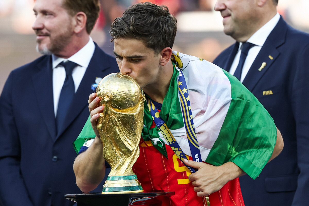 Spain's midfielder #09 Gavi kisses the trophy after winning the 2026 World Cup football tournament final match between Spain and Argentina at the New York/New Jersey Stadium in East Rutherford on July 19, 2026. (Photo by FRANCK FIFE / AFP)