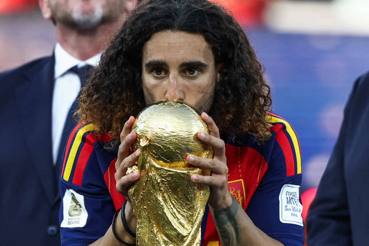 Spain's defender #24 Marc Cucurella kisses the trophy after winning the 2026 World Cup football tournament final match between Spain and Argentina at the New York/New Jersey Stadium in East Rutherford on July 19, 2026. (Photo by FRANCK FIFE / AFP)