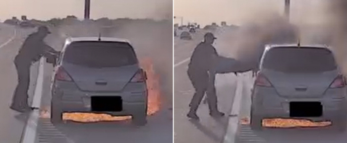 'Come out through the window!' ... Police hero saves driver trapped in a burning vehicle