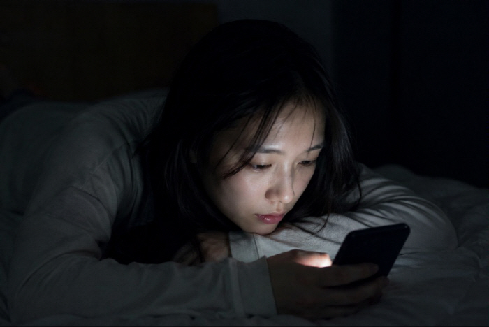 Touching a Smartphone in the Dark... Could It Cause Blindness?